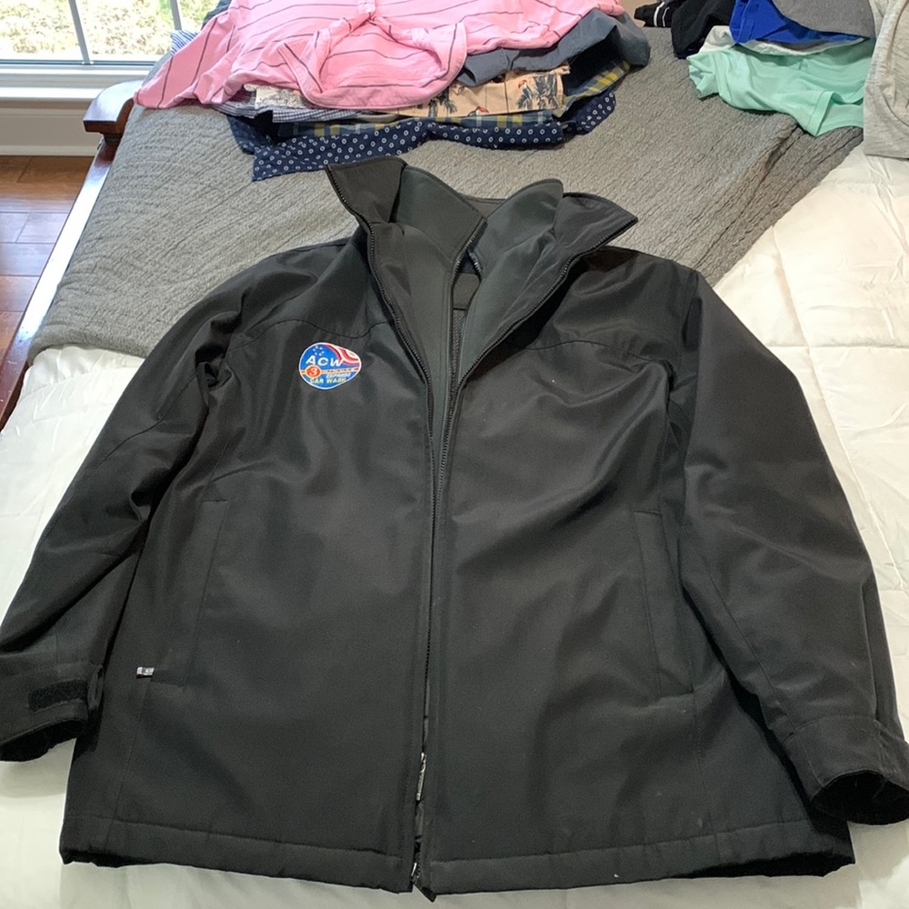 Heavy duty lined rain jacket, used like new. Does have a logo patch.